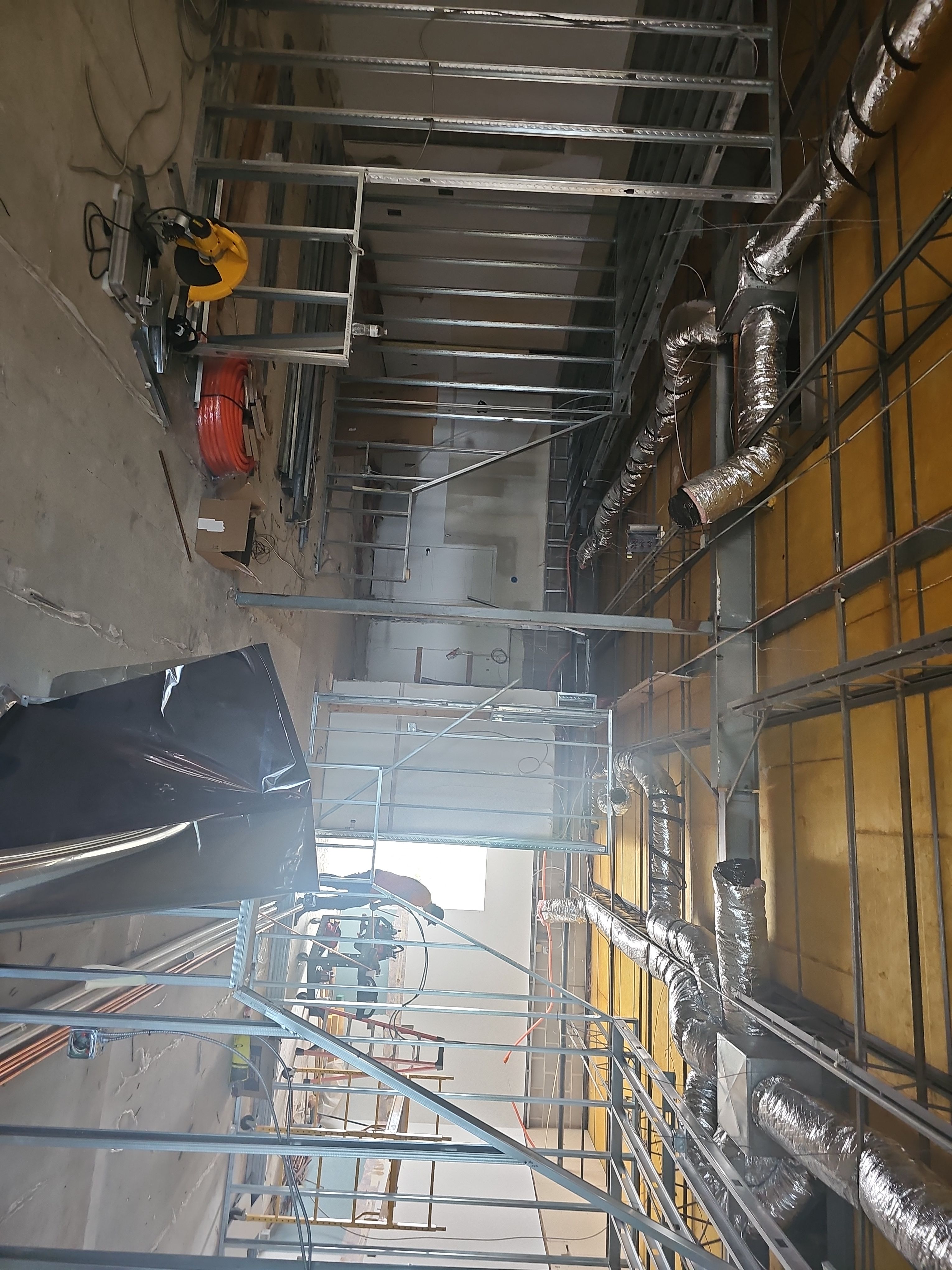 The raw commercial space during early steel-stud framing of All Seasons Indoor Golf Club in Kansas City