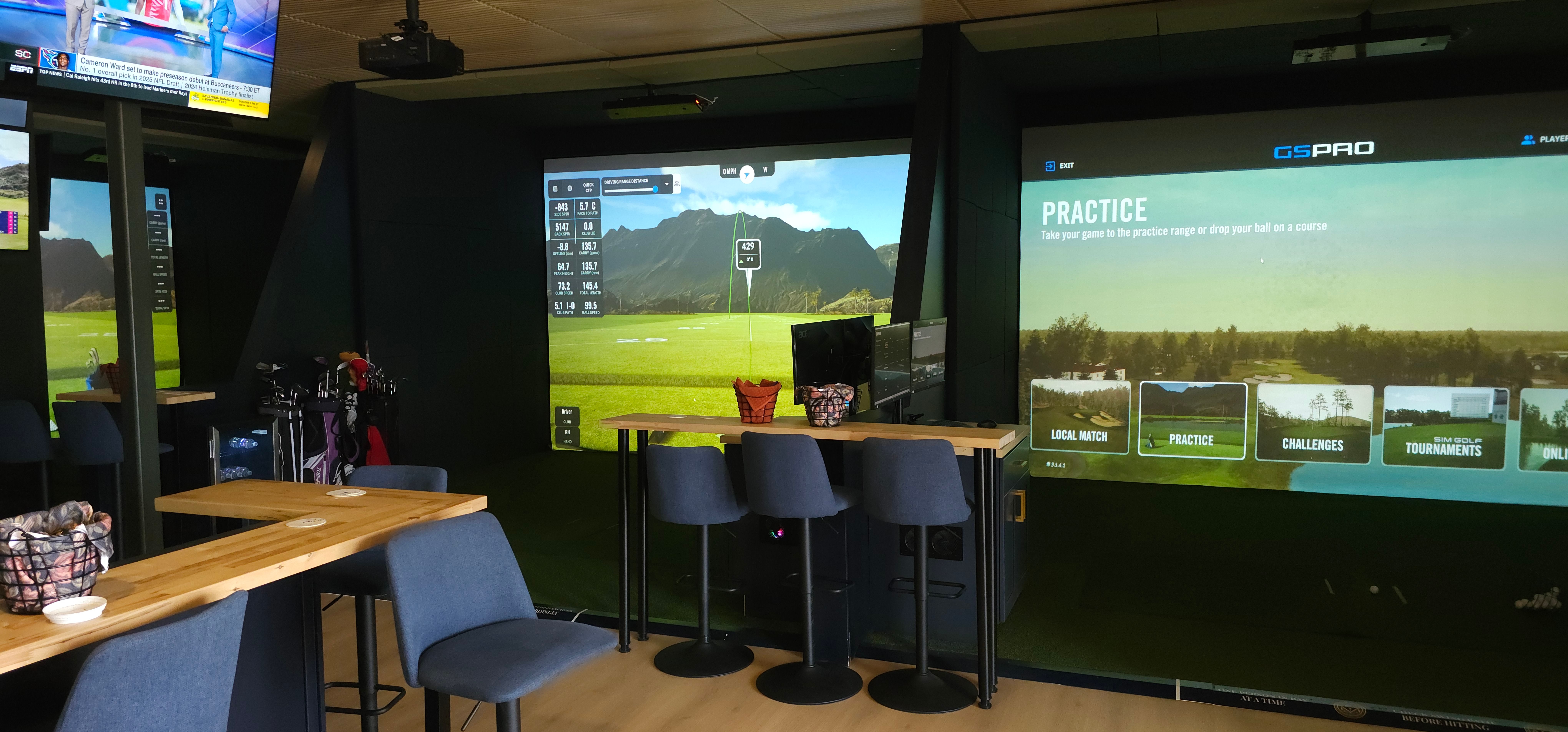 The finished floor at All Seasons Indoor Golf Club with bar seating and multiple simulator bays