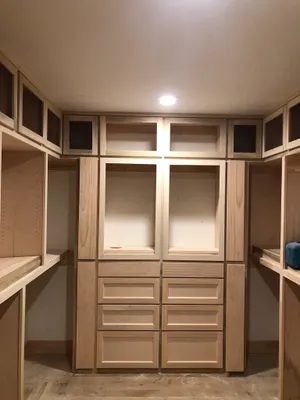 Custom maple closet cabinetry built by All Seasons in Kansas City