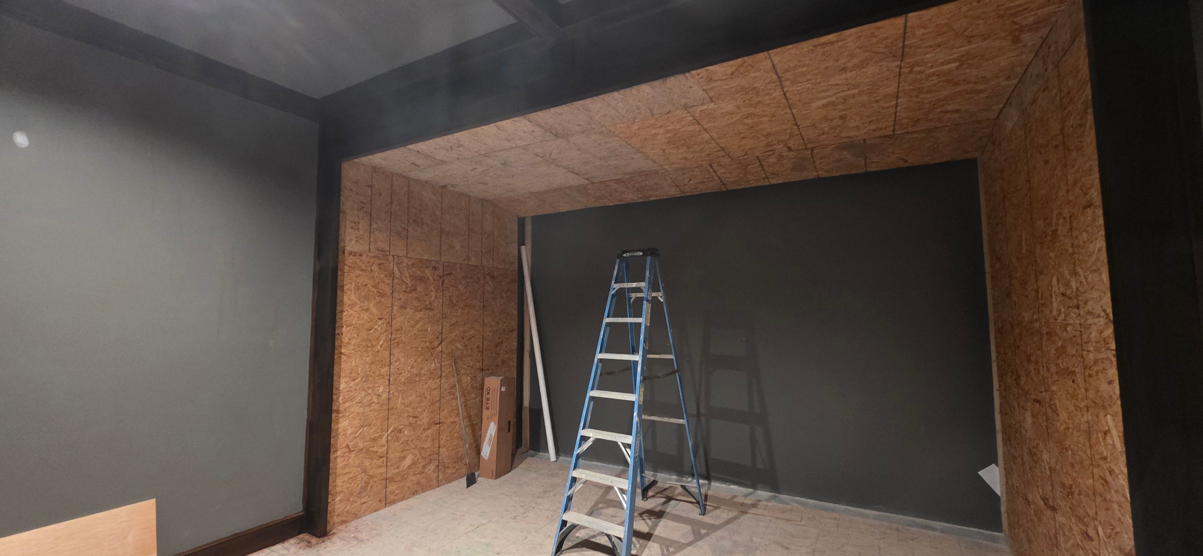 Framing the pitched ceiling and recess that hides the screen border in the Grain Valley golf simulator