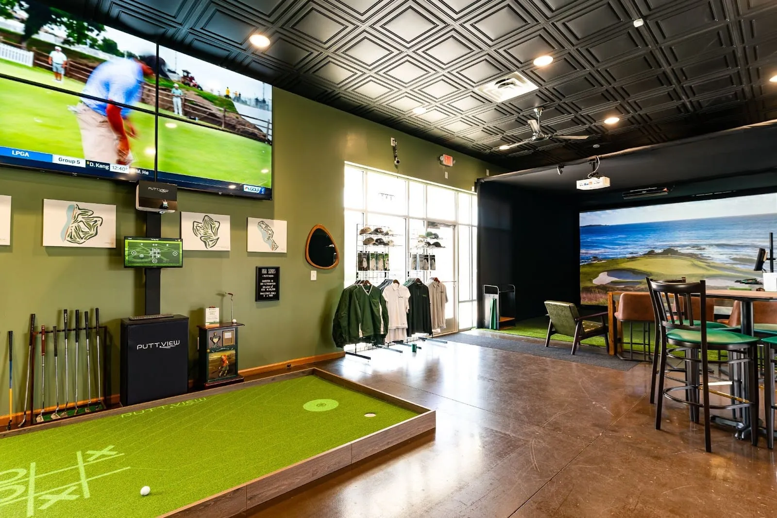 Indoor golf facility with a putting green and pro shop — see builds like it at the All Seasons Kansas City showroom