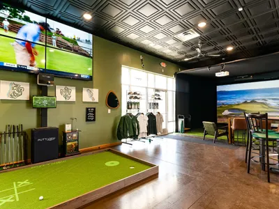 All Seasons Indoor Golf Club — the putting green and simulator bays we built and run