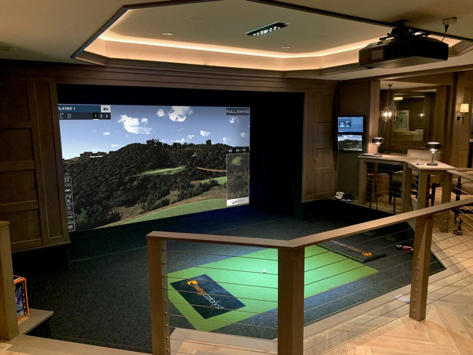 Wood-paneled luxury golf simulator room, built for a Branson, Missouri home