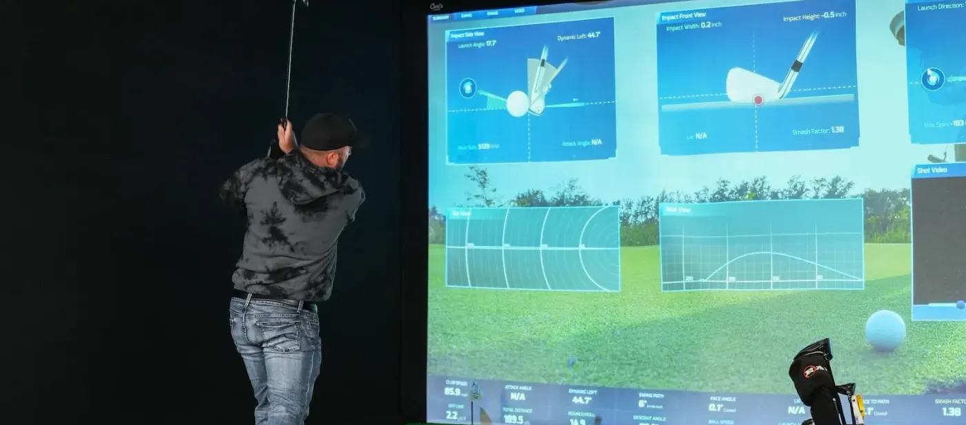 ProTee VX overhead launch monitor in a finished golf simulator room